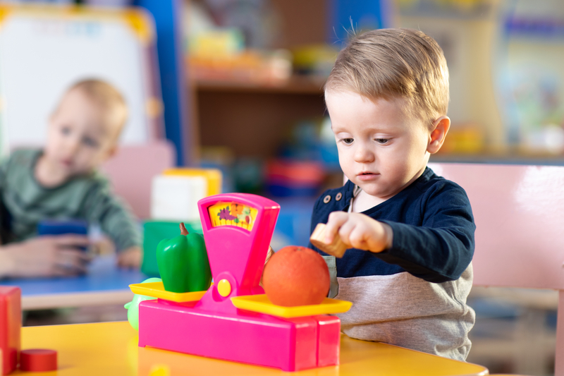 child playing with scales